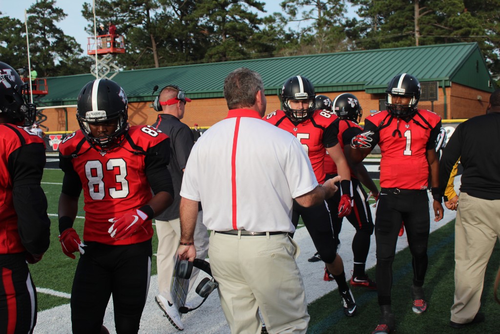 Dean preps his offense before they head back to the field. (Photo Courtesy: Kristin Whitman/THE SPECTATOR)